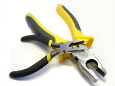 The Big And Small Flat-nose Pliers On A White Back Stock Photography
