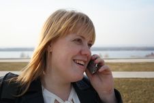 Pretty Girl Talking On Mobile Phone Royalty Free Stock Images