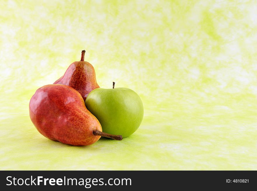 Pears and green apple isolated