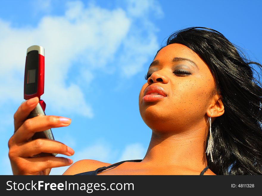 Attractive woman reading a text message