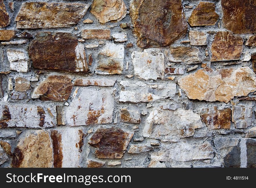 Crude stone wall and cement. Crude stone wall and cement