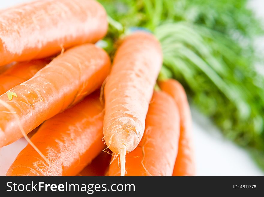 Fresh carrots on a white background