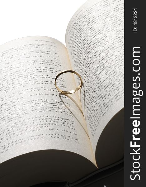 Gold ring shadow over the book. Gold ring shadow over the book