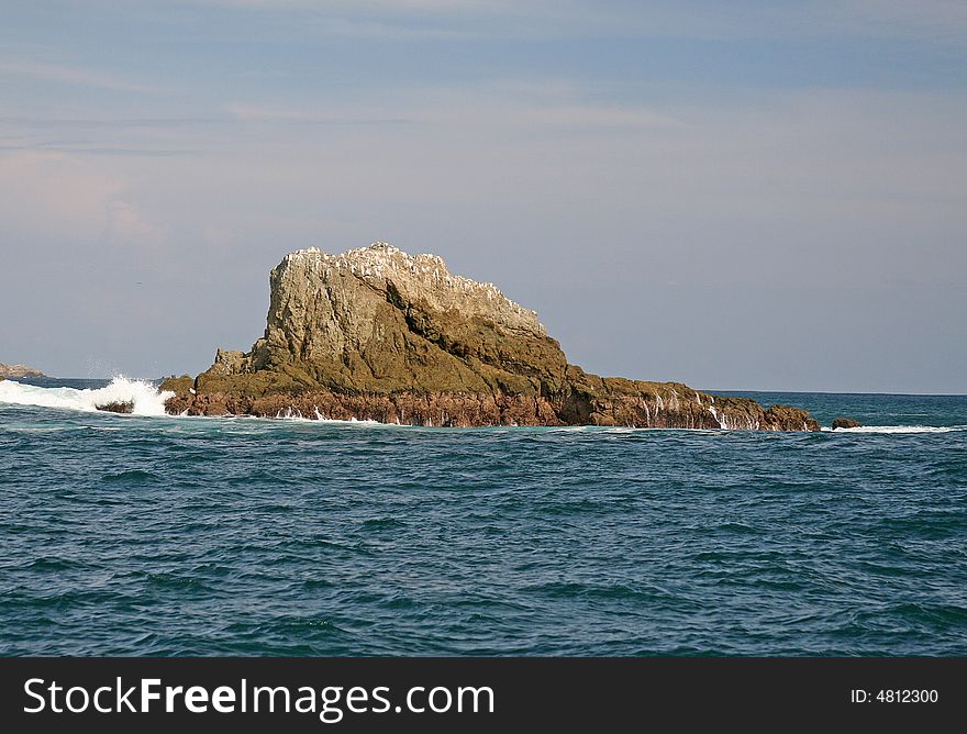 View of the Pacific ocean and rocks on the coast of Costa Rica