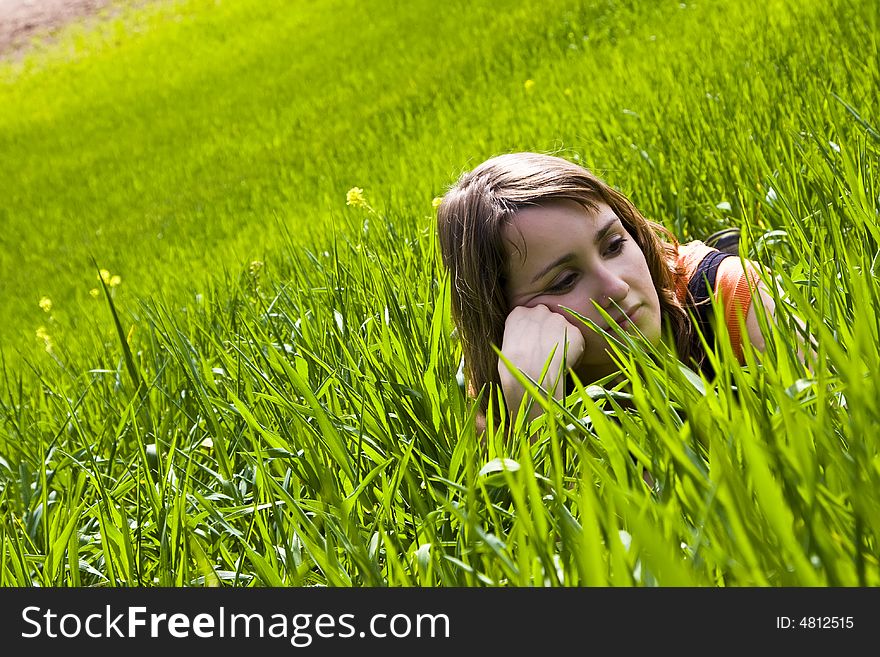 Young slept woman trough the grass. Young slept woman trough the grass