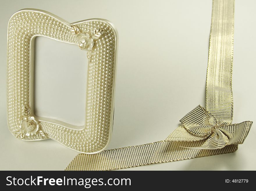 Golden ribbon and pearl picture frame