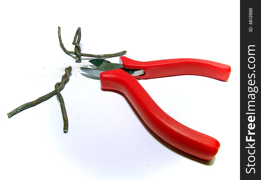 Flat-nose pliers cut the small wire little man. Flat-nose pliers cut the small wire little man
