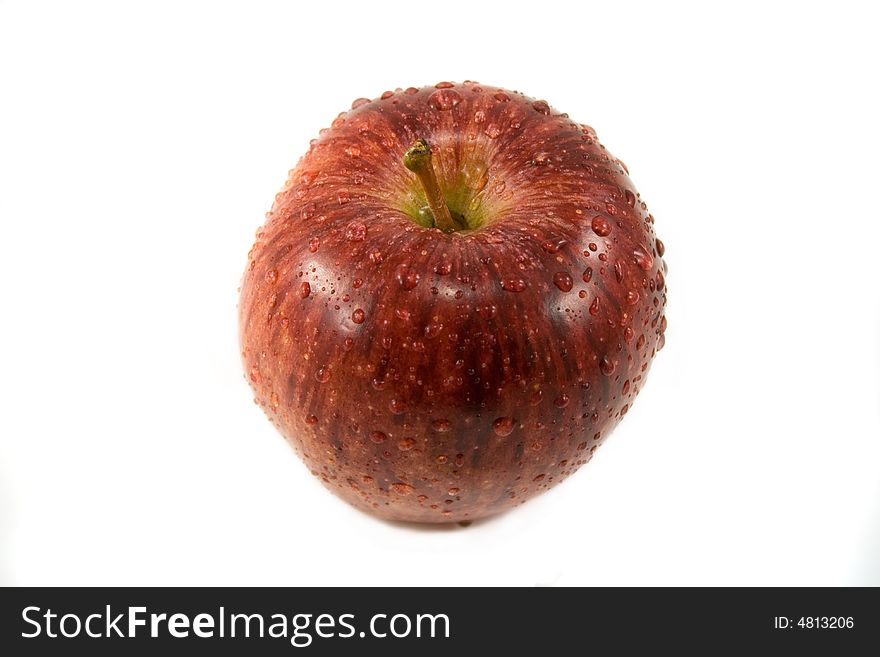 Red apple with waterdrops isolated on white. Red apple with waterdrops isolated on white