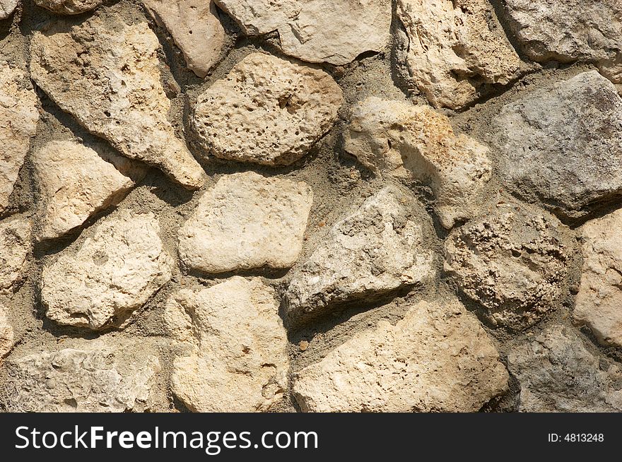 Wall built from limestone, textured background. Wall built from limestone, textured background