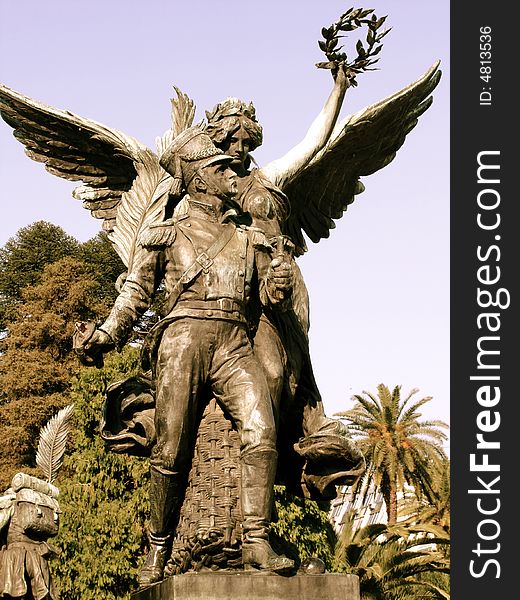 Buenos Aires, Argentina.
The image shows a statue of a man and an angel. Buenos Aires, Argentina.
The image shows a statue of a man and an angel.