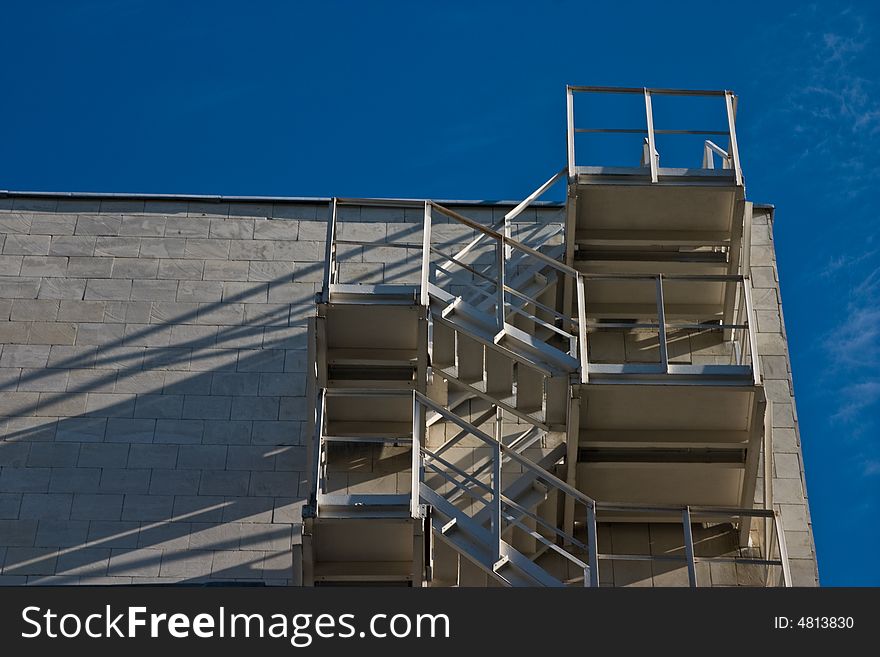 Architecture series: white building with safety stairs