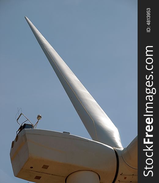 Closeup of wind turbine blade and generation shack. Closeup of wind turbine blade and generation shack