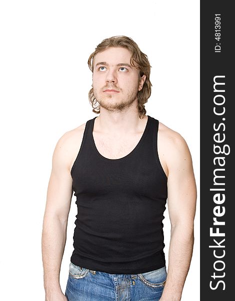 Young man in black sleeveless jacket and jeans isolated. Young man in black sleeveless jacket and jeans isolated