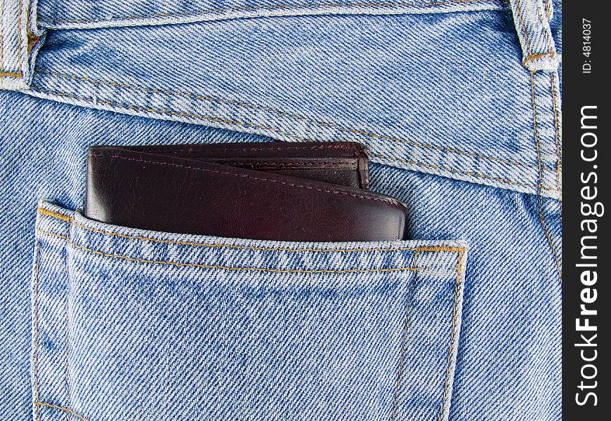 Jeans and brown leather wallet in pocket. Jeans and brown leather wallet in pocket