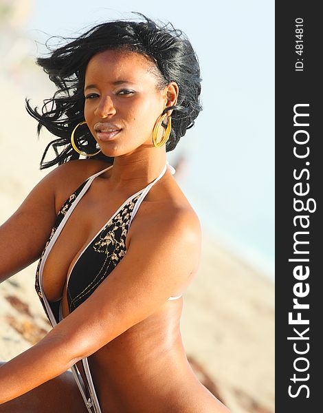 Attractive black woman on the beach