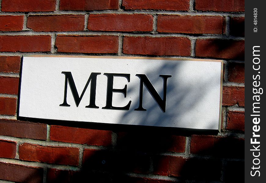 Picture of the sign Men on the wall