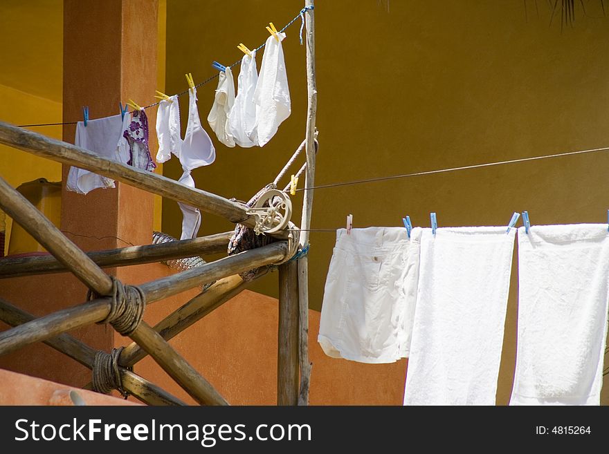 Clothes drying on a beach house. Clothes drying on a beach house