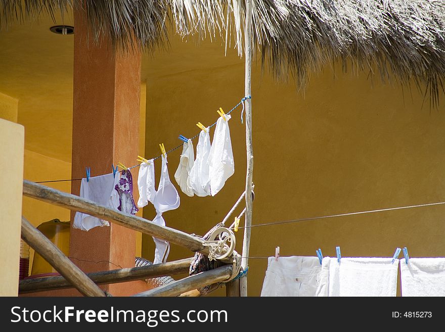 Clothes drying on a beach house. Clothes drying on a beach house