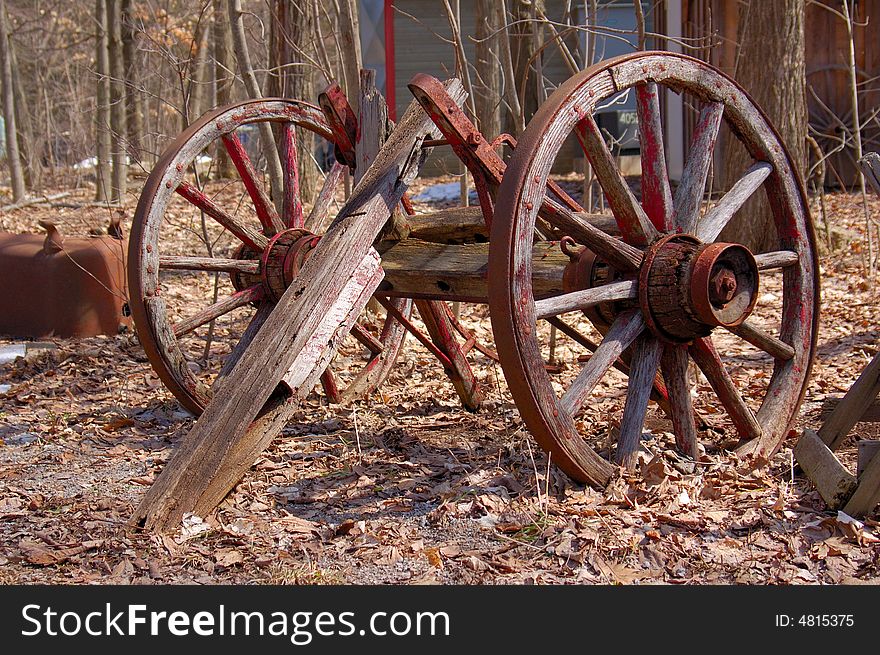 An image of a couple of old wheels from a broken cart.