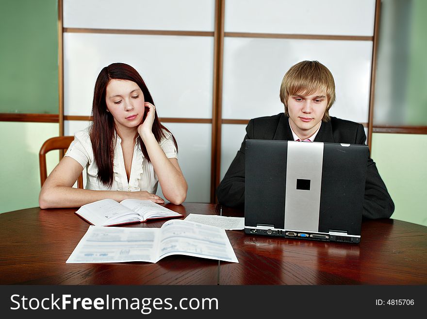 Group of business people working together in the office. Group of business people working together in the office.