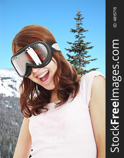 Portrait of a styled professional model. Theme: mountain skis