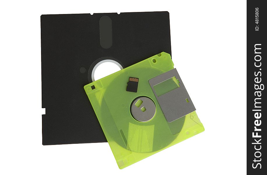 Floppy disks and flash drive on white