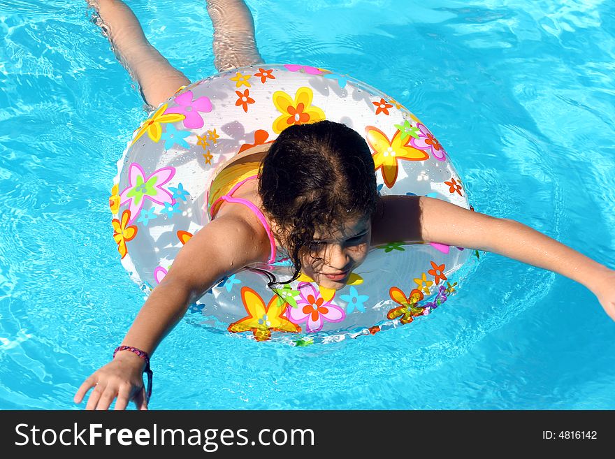 Young girl Swimming yo in Pool. Young girl Swimming yo in Pool