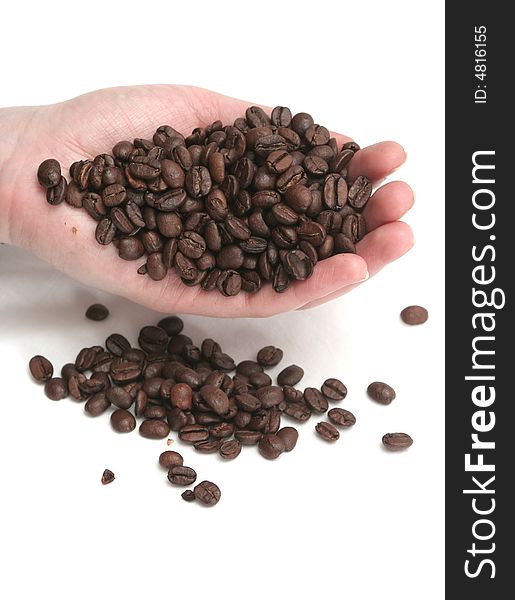 It is a lot of grains of coffee lay in hands