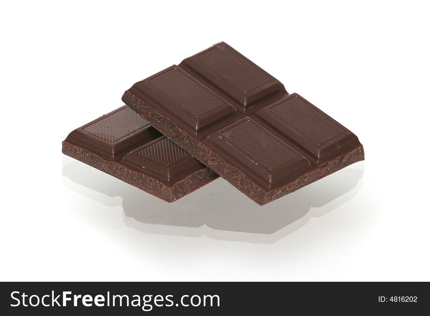 Two Segments Of Chocolate On A White Background