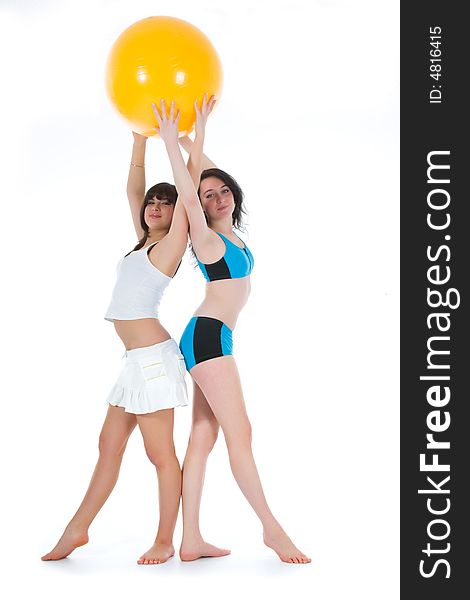 Girls practicing fitness  on  white  background