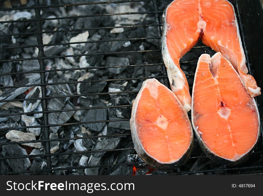 Close-up of grilled salmon pieces (background)