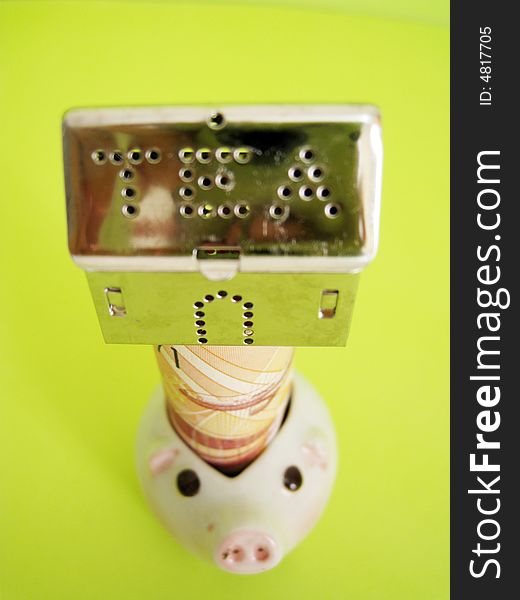 A house on top of money and piggy, metaphors for banking, finance