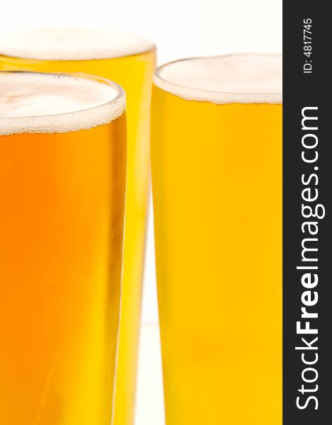 Ice cold beers isolated against a white background