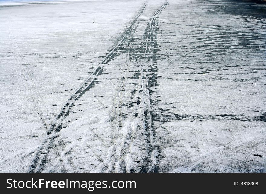 Car track on the stood pond. Car track on the stood pond