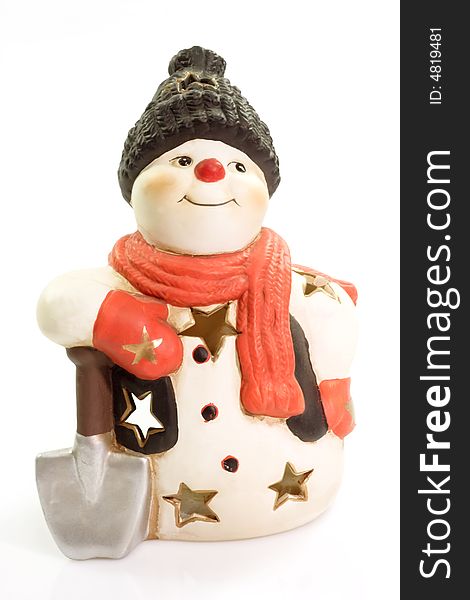 Figurine of a snowman on bright background. Figurine of a snowman on bright background