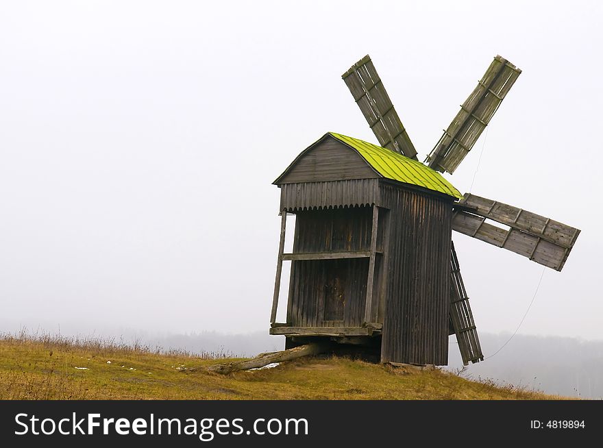 Windmill in ukranian village at winter time. Windmill in ukranian village at winter time