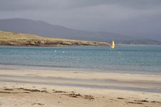Windsurfer By A Sandy Beach Royalty Free Stock Photography Windsurfer By A Sandy Beach Royalty Free Stock Photography