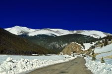 A Snowy Road In Colorado During Winter Stock Photo A Snowy Road In Colorado During Winter Stock Photo