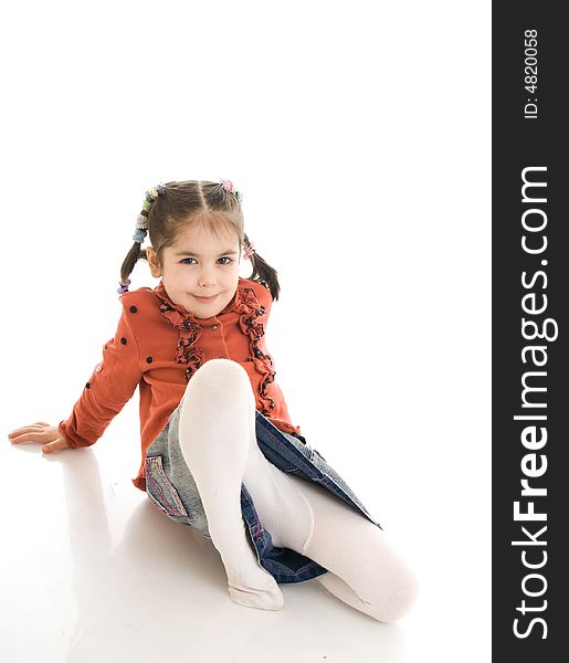 The little laying girl isolated on a white background