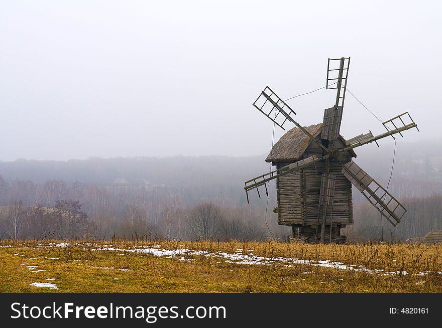 Windmill in ukranian village at winter time. Windmill in ukranian village at winter time