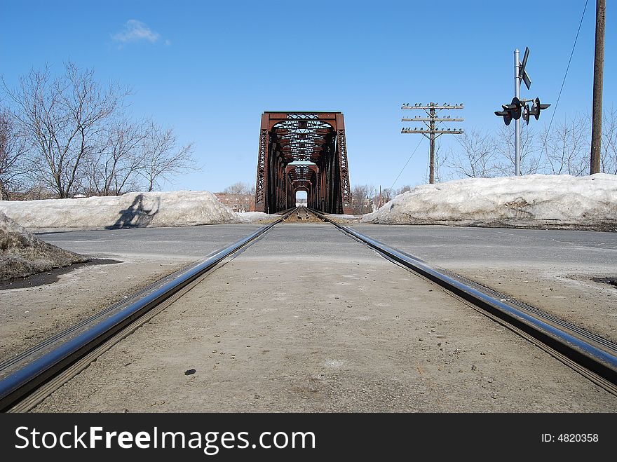 A train track with a bridge