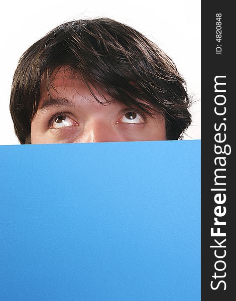 Portrait of young man, holding a blue billboard. Portrait of young man, holding a blue billboard