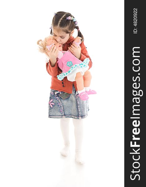 The little girl with a doll isolated on a white background