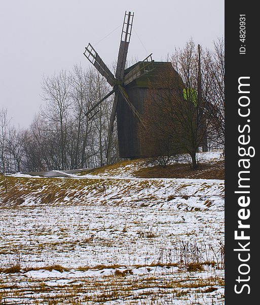 Windmill in ukranian village at winter time. Windmill in ukranian village at winter time