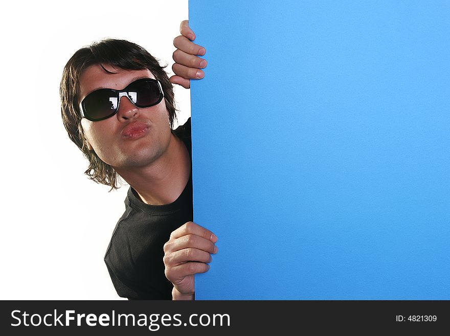 Man holding a blue billboard with sunglasses. Man holding a blue billboard with sunglasses
