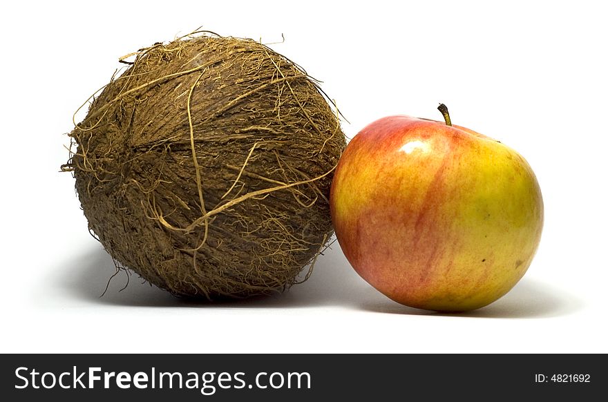 Apple and coconut together on white background. Apple and coconut together on white background