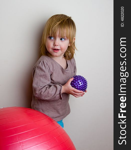 The little girl with a  ball