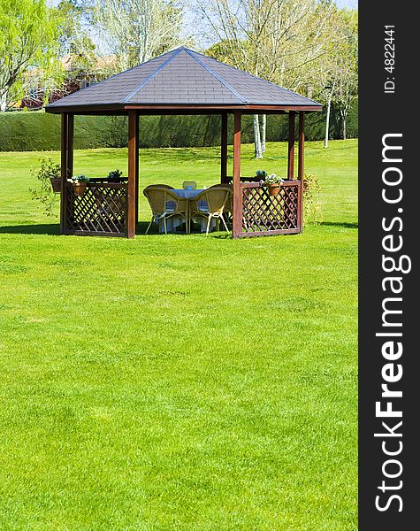 Garden with chairs for a coffe or tea break. Garden with chairs for a coffe or tea break