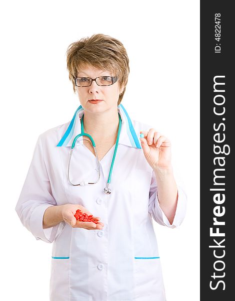 Woman doctor with pills in hands. Woman doctor with pills in hands