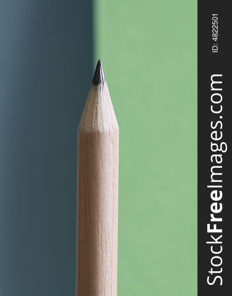 A pencil with a simple color background